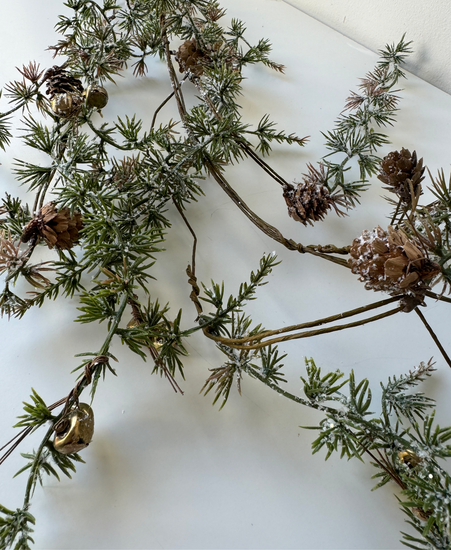 Larch garland with cones and bells