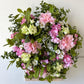 Spring door decoration with pink flowers