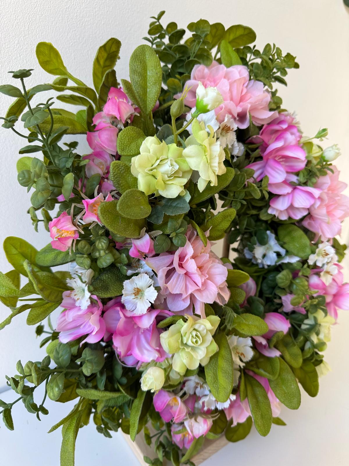 Spring door decoration with pink flowers