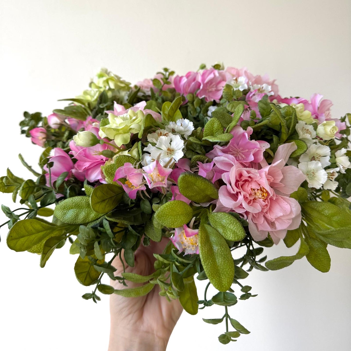 Spring door decoration with pink flowers