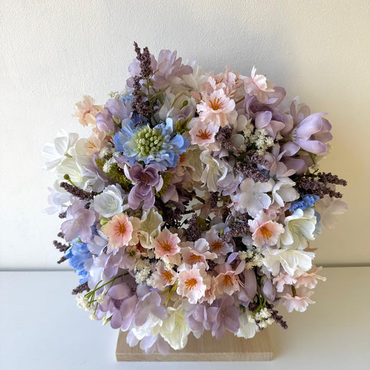 Spring door decoration with pastel flowers