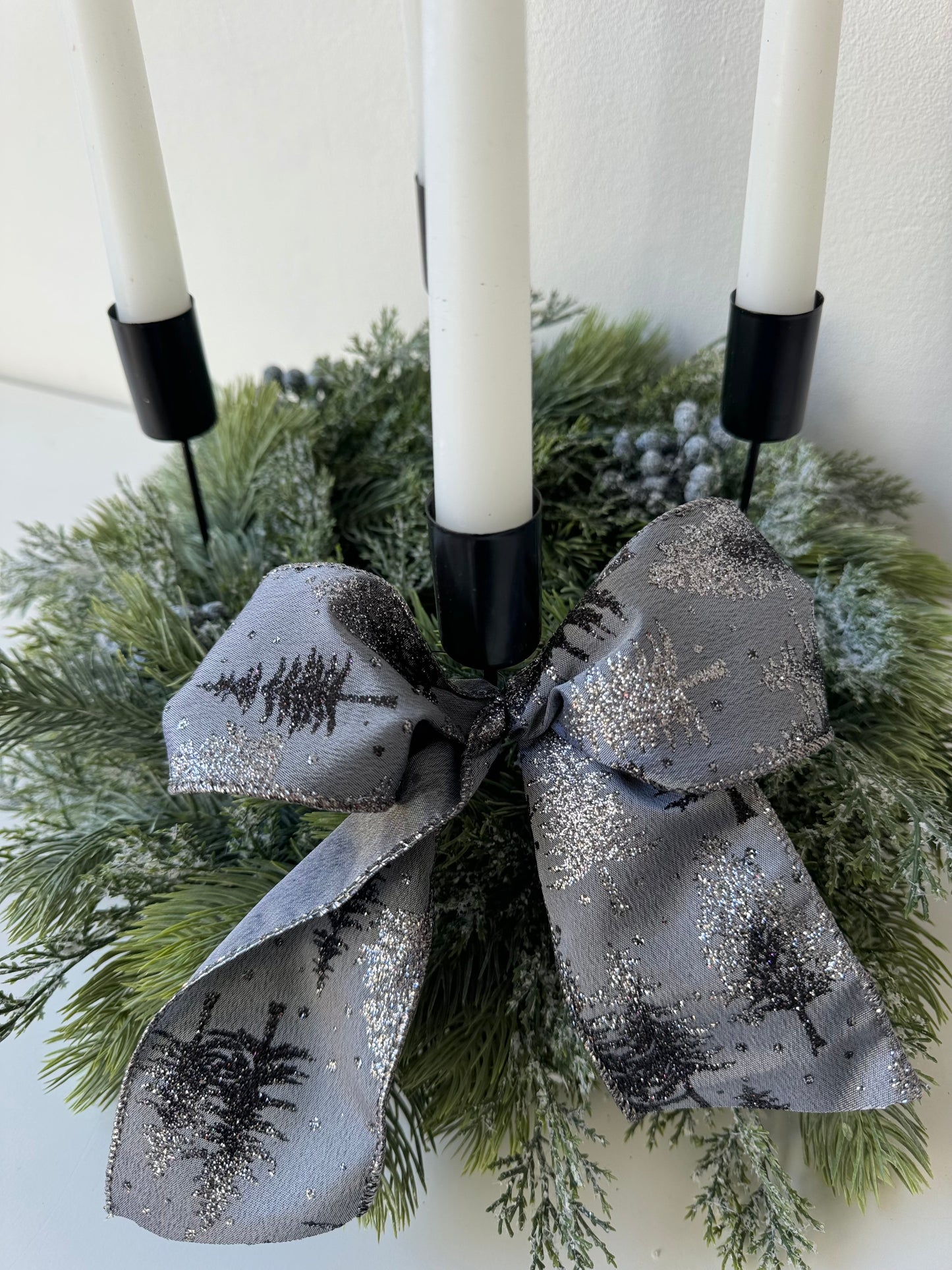 Advent wreath with snowy blue berries