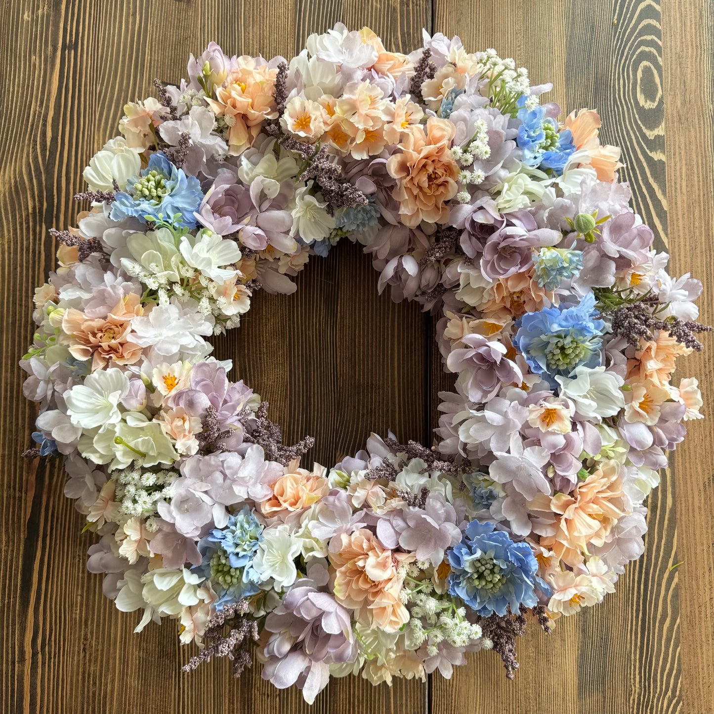 Spring door decoration with pastel flowers