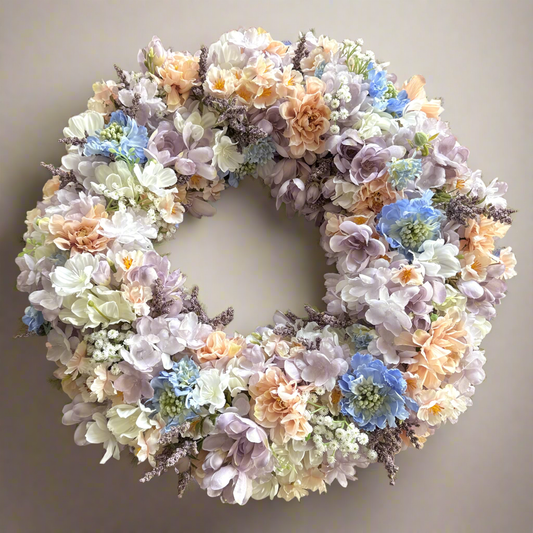 Spring door decoration with pastel flowers