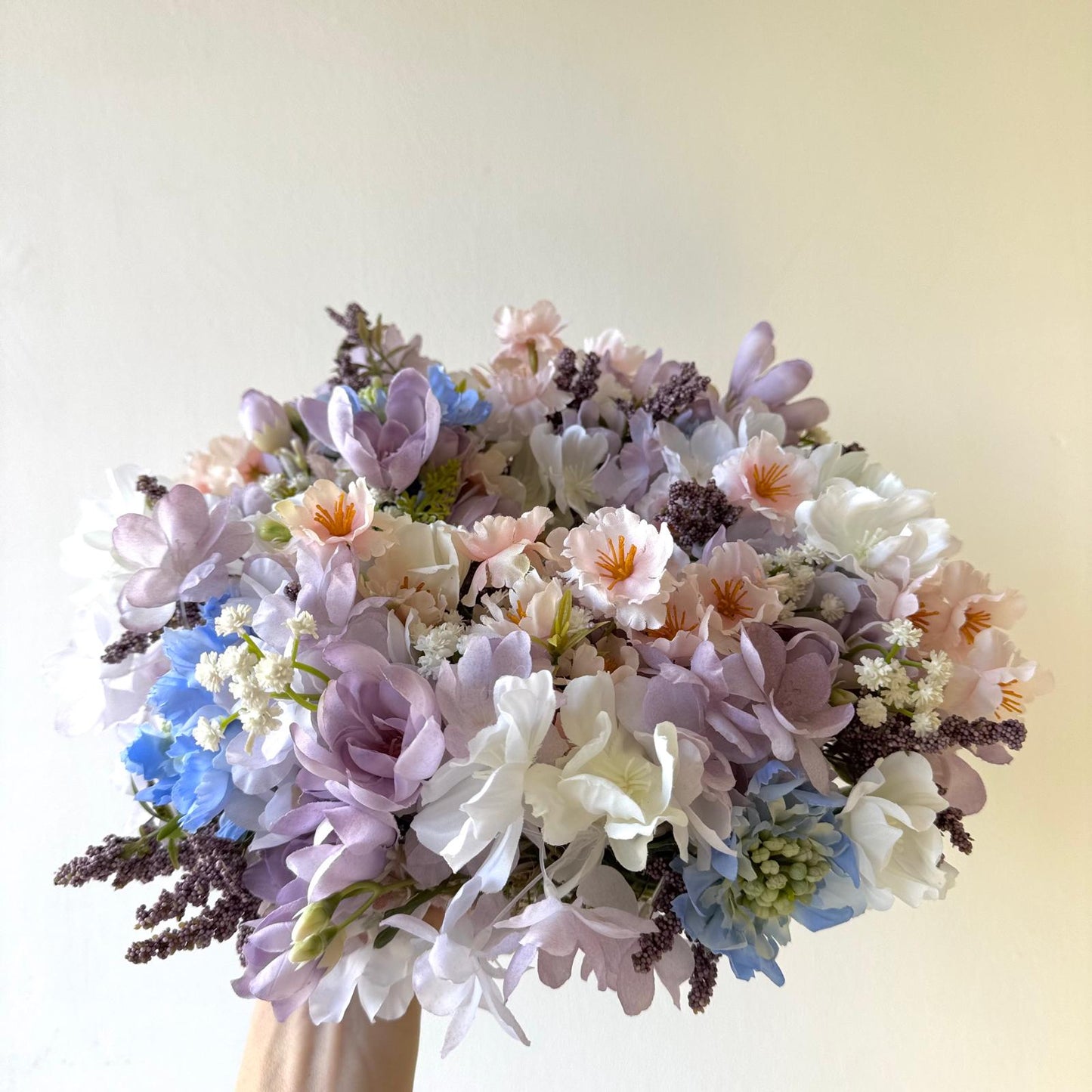 Spring door decoration with pastel flowers