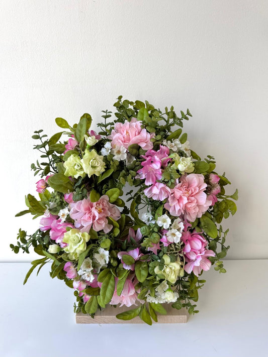 Spring door decoration with pink flowers